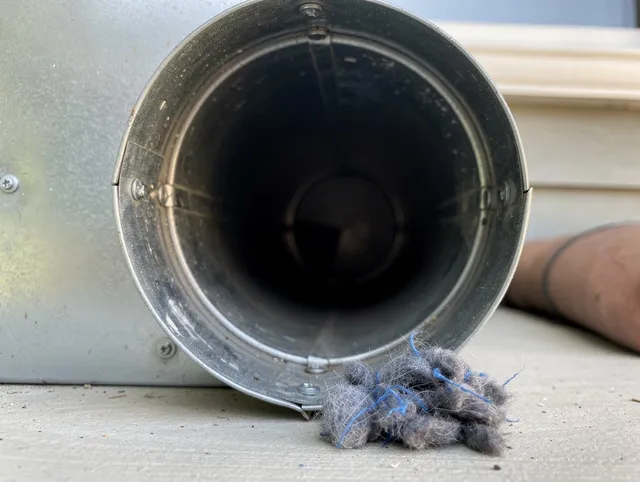 Brea Dryer Vent Cleaning technician using specialized equipment to clear severe dryer vent blockage in Brea